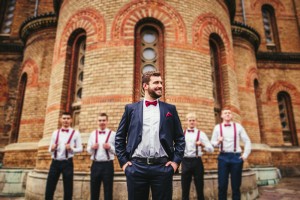 groom and groomsmen in front of church