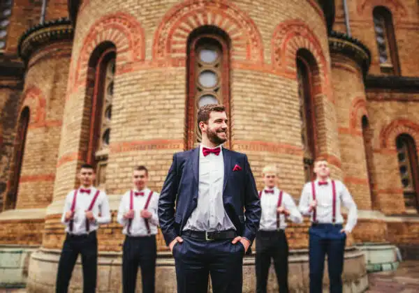 groom and groomsmen in front of church